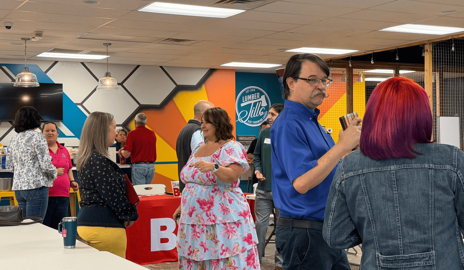 Group of BNi members talking at a networking event